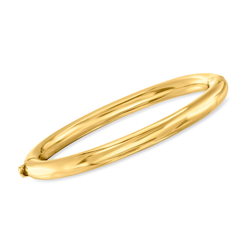 Polished gold-tone bangle bracelet with hinged clasp, smooth rounded profile