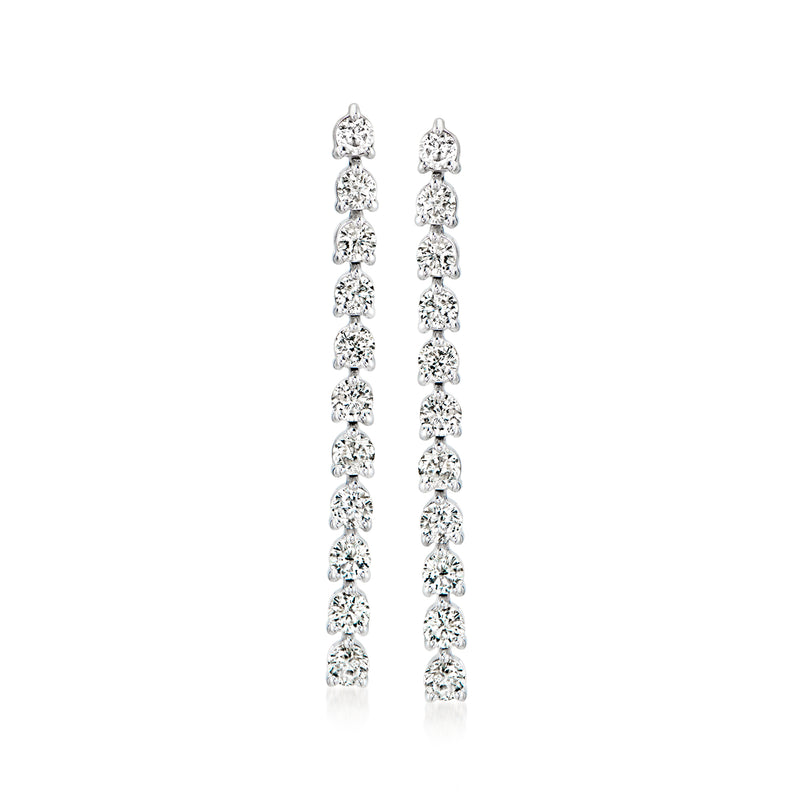 Diamond linear drop earrings in 14kt white gold, dangling vertical rows of round stones.