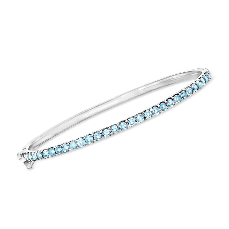 Sterling silver bangle bracelet with blue topaz row