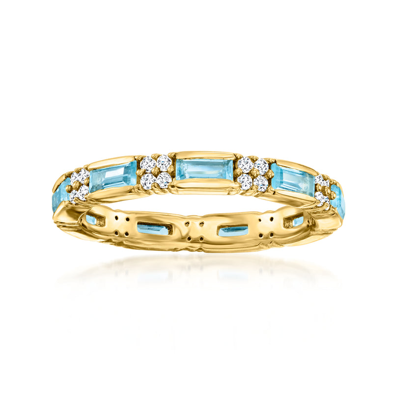 Gold eternity band ring with blue topaz and white zircon stones