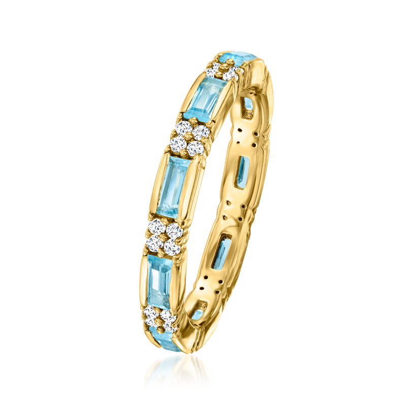 Gold eternity band ring with blue topaz rectangles and white zircon accents