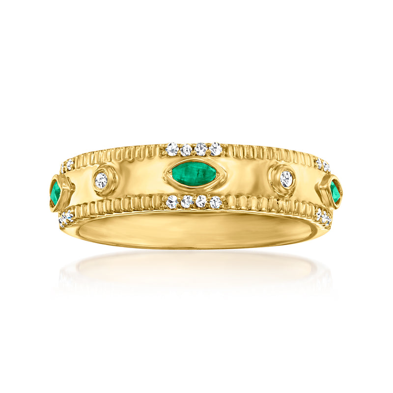 Gold-tone ring with oval emerald center, diamond side stones, and scalloped bezel band