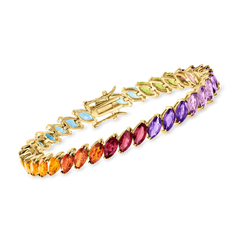 Multi-gemstone tennis bracelet with gold links and oval purple, red, orange & blue stones.