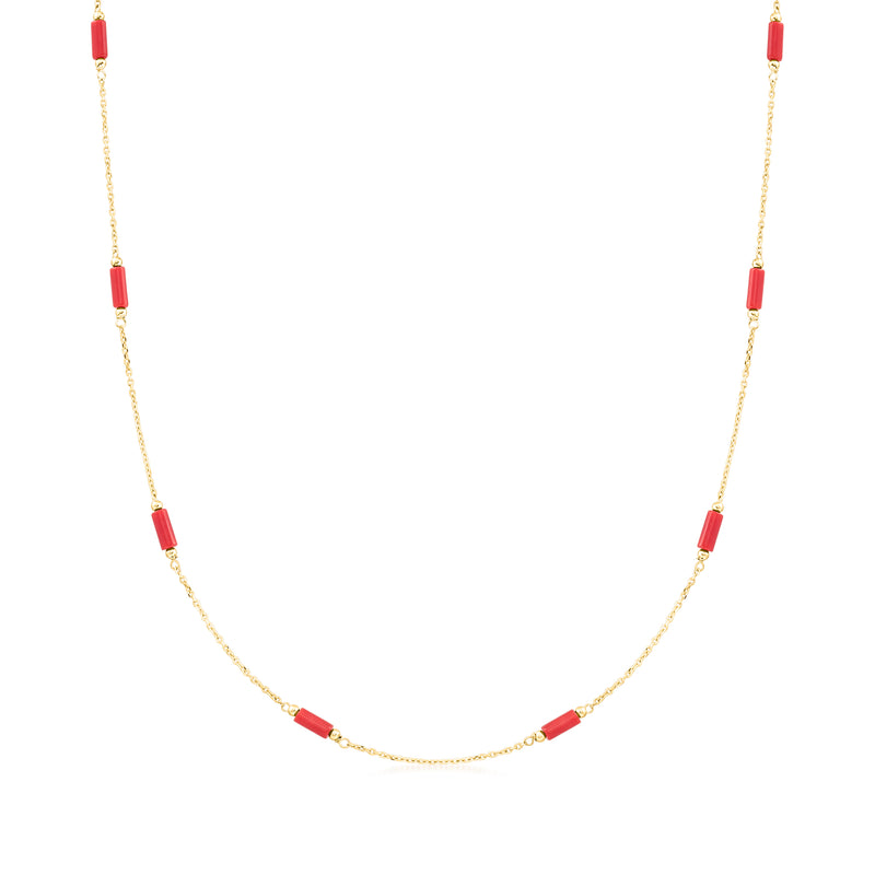 Gold station necklace with red coral-style beads in evenly spaced segments