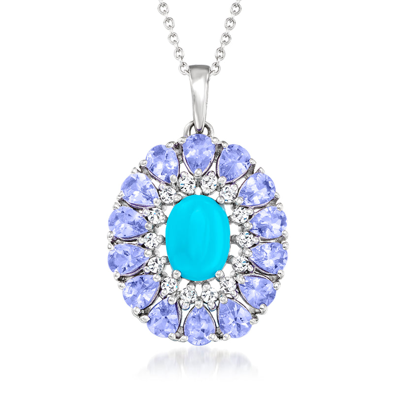 Sterling silver pendant necklace with oval turquoise center surrounded by blue and clear stones
