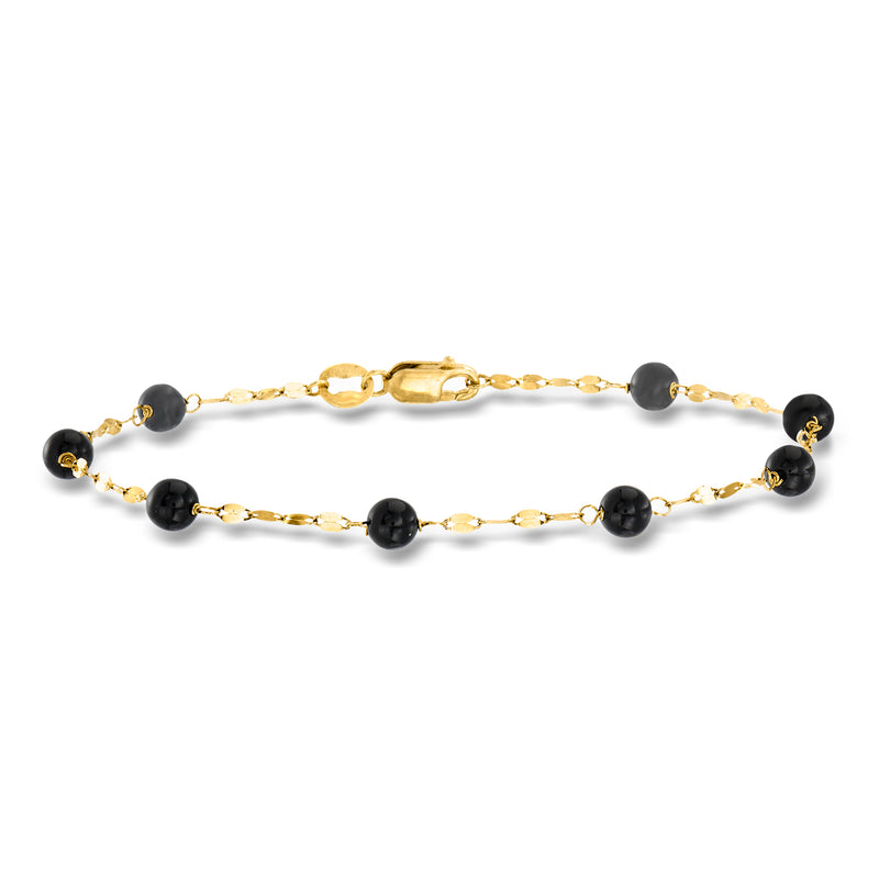 Yellow gold bead station bracelet with dark onyx-like beads and oval links