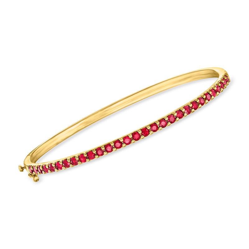 Gold over sterling ruby bangle bracelet with row of round red gemstones