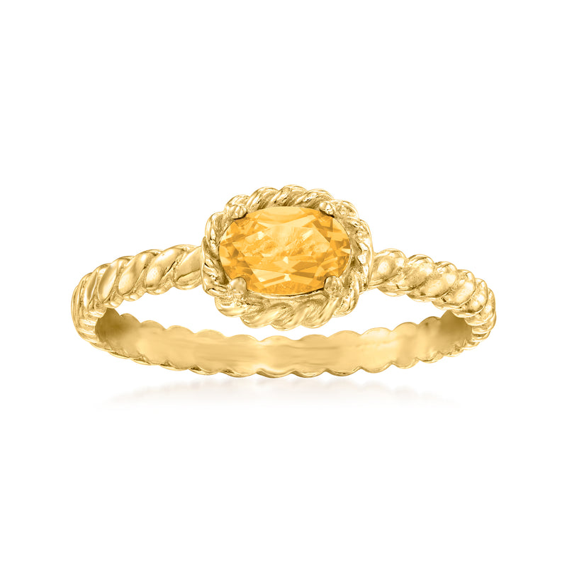Twisted gold ring with oval citrine-yellow gemstone bezel setting