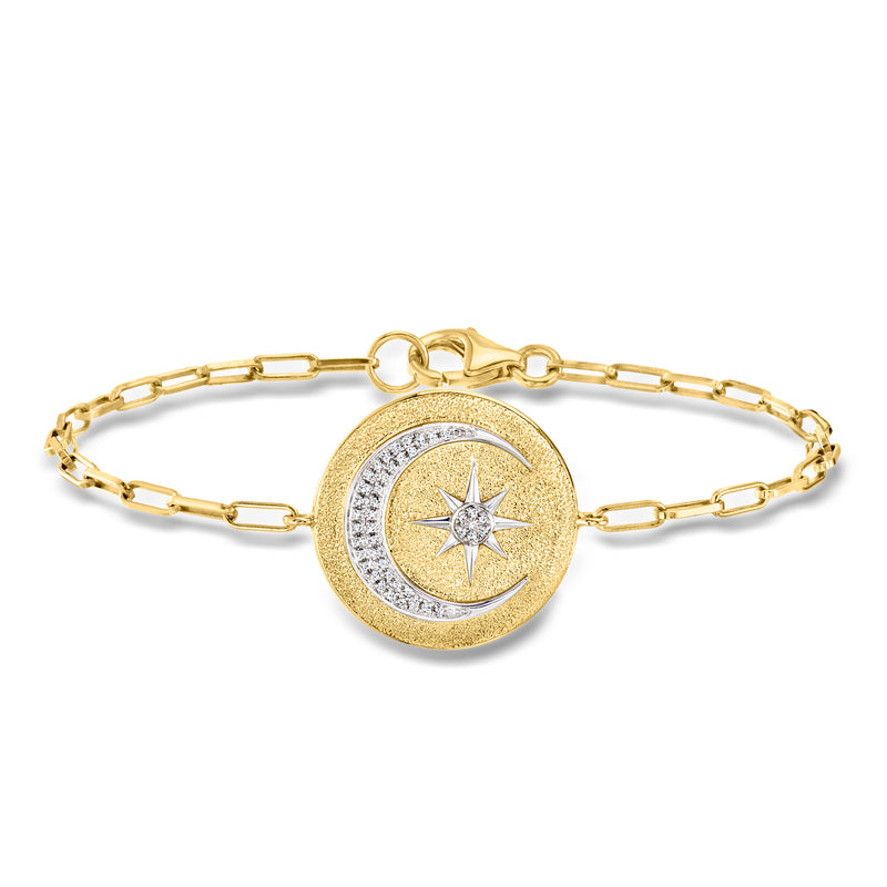 Gold celestial charm bracelet with circular moon-and-star pendant and glittering stones