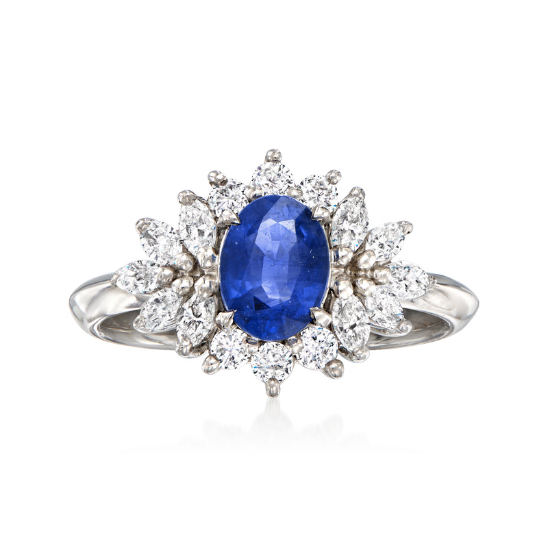 Vintage sapphire and diamond halo ring in platinum with blue oval center stone
