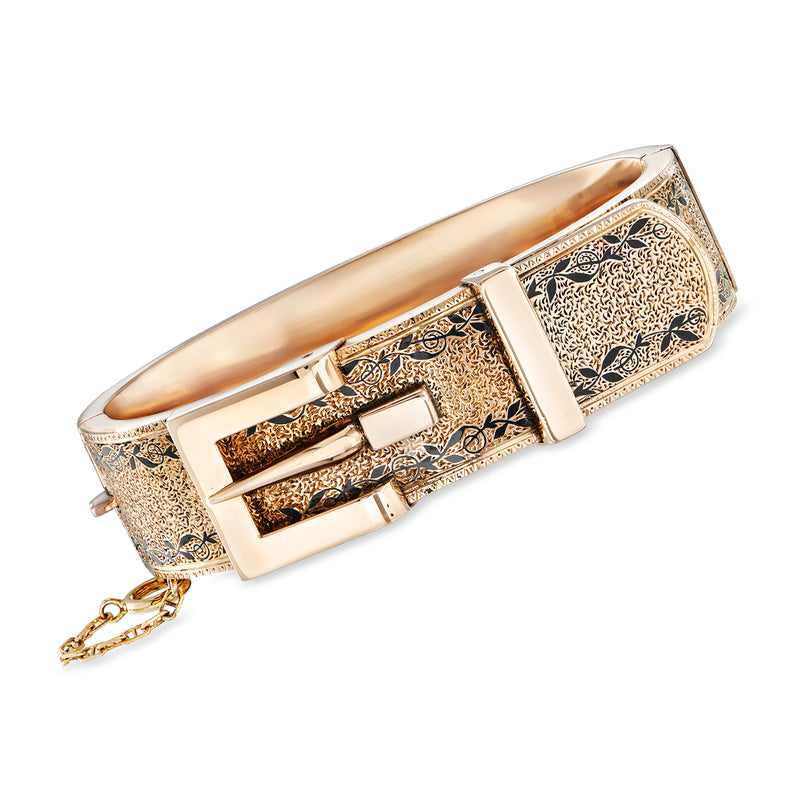 Vintage gold-tone buckle bangle bracelet with engraved center panel and black enamel accents