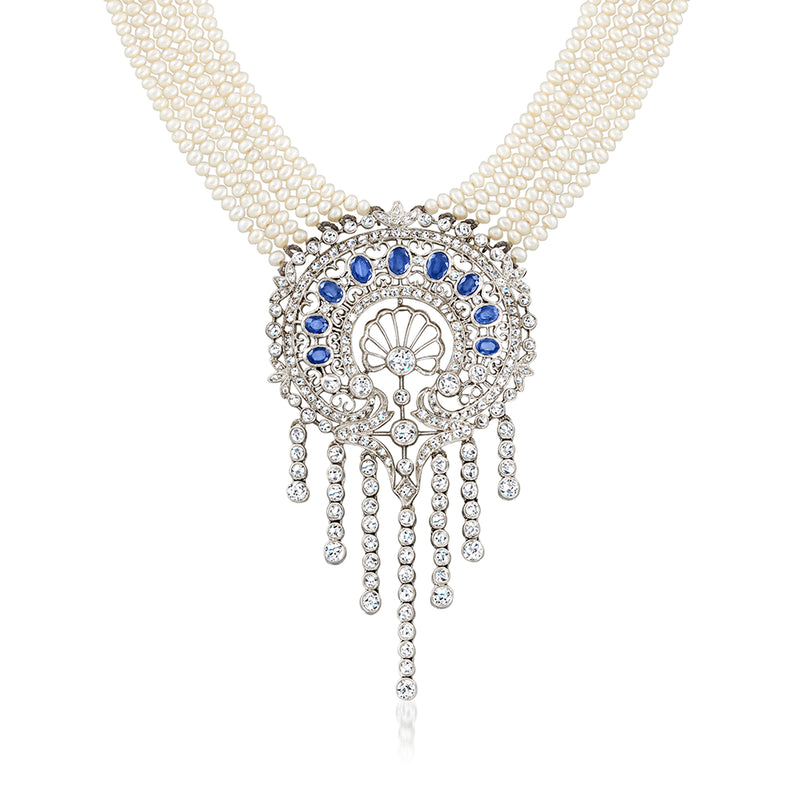Multi-strand pearl necklace with blue stone and diamond-like oval fringe pendant, white gold