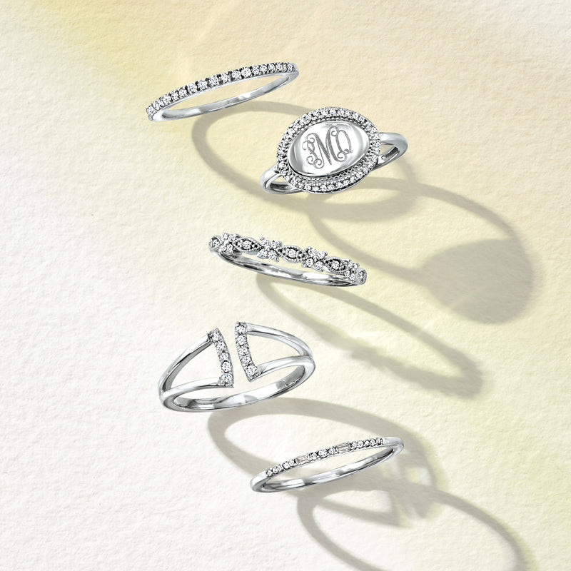 Sterling silver diamond rings set with oval and round stones on linked bands
