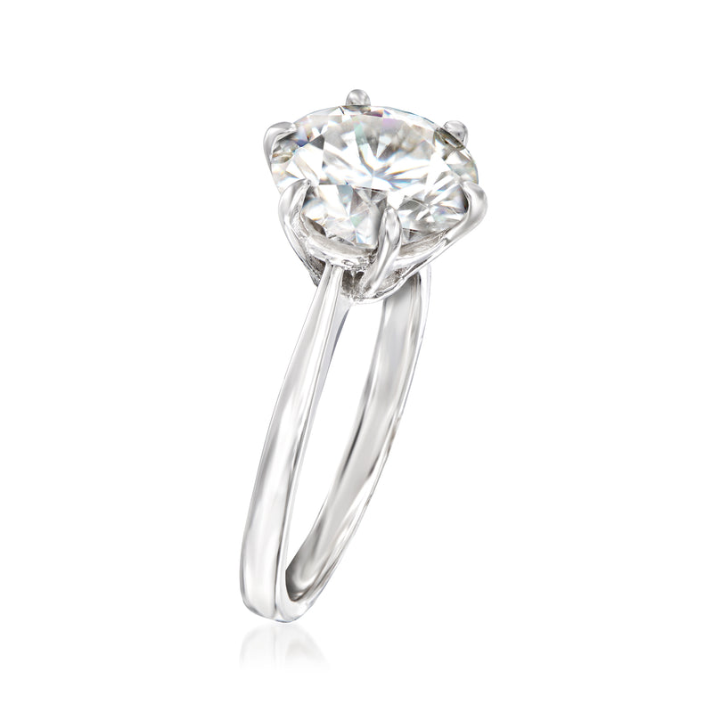 Sterling silver solitaire ring with round moissanite center, side view, four-prong setting