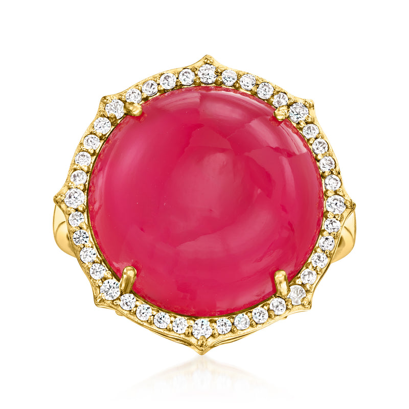 Gold-tone ring with large oval pink gemstone and white zircon halo