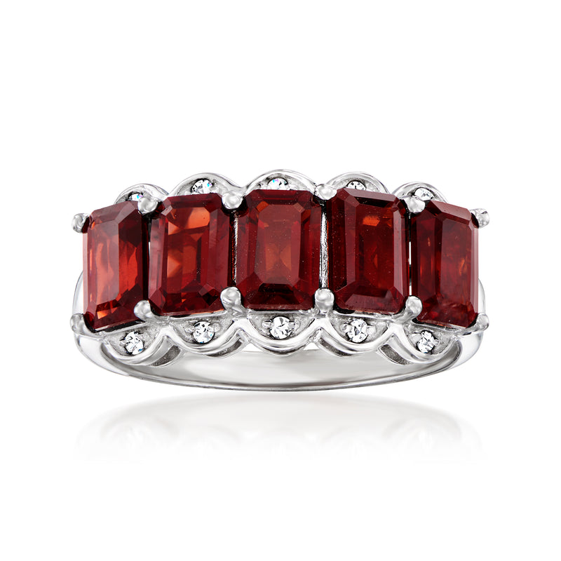 Sterling silver five-stone garnet ring with diamond accents, red rectangular stones.