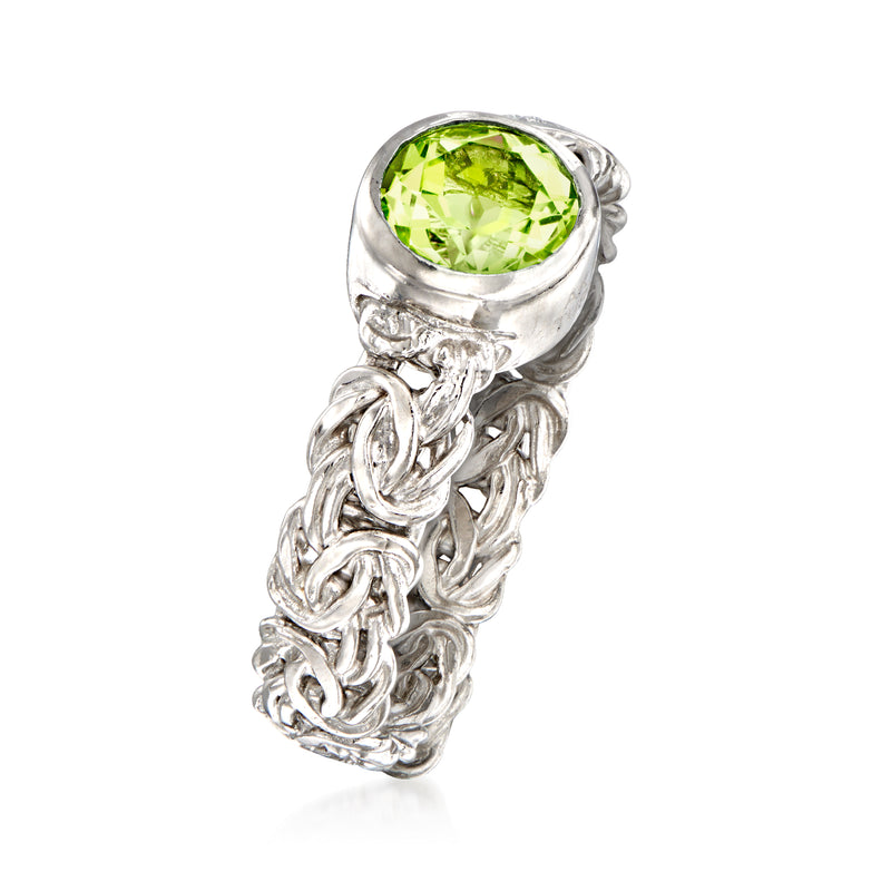 Sterling silver ring with round bezel-set peridot and braided Byzantine band