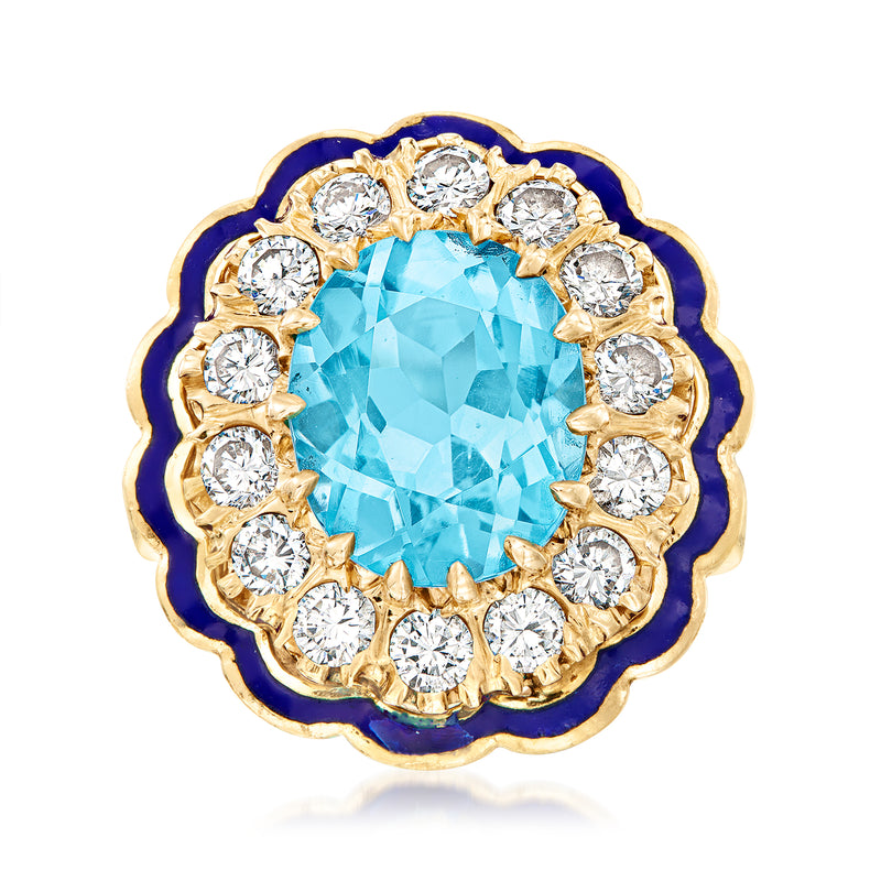 14kt yellow gold cocktail ring with oval Swiss blue topaz, diamond halo, and blue enamel edge