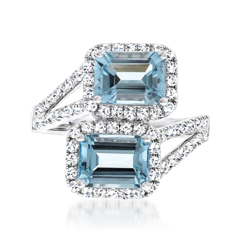Aquamarine bypass ring with rectangular blue gemstones and diamond halo, 14k white gold