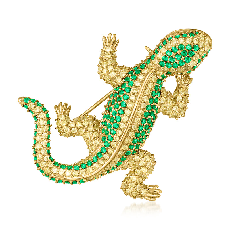 Gold-tone lizard pin with green simulated gemstone scales, curved tail and legs