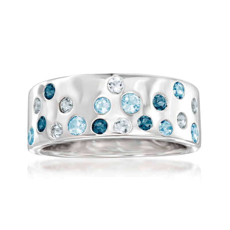 Sterling silver ring with blue topaz and clear round gemstones, domed band
