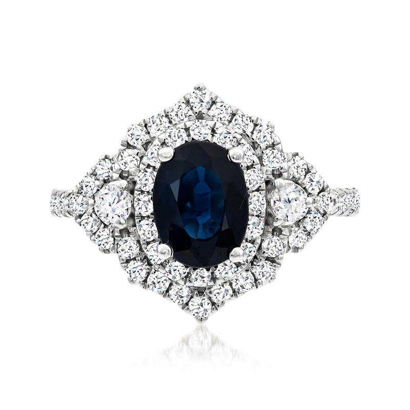 White gold sapphire and diamond halo ring with oval center stone