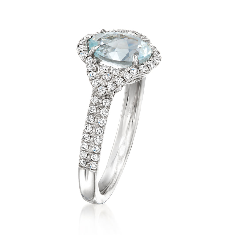 Aquamarine and diamond ring in white gold with oval halo setting
