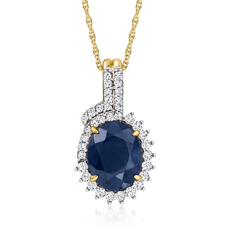 14kt yellow gold pendant with round blue sapphire center and diamond halo