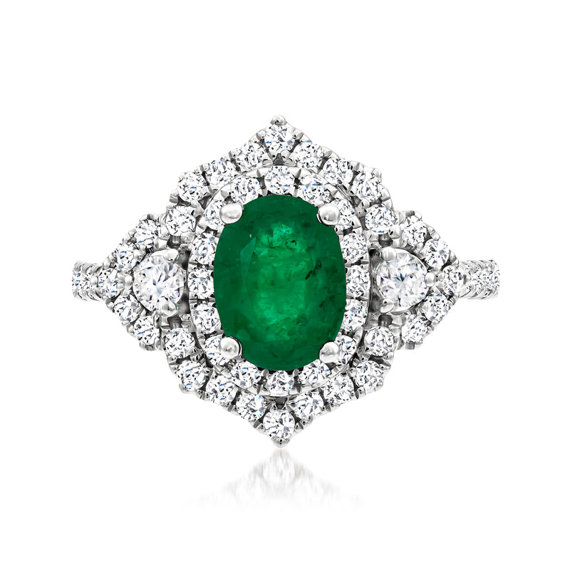 White gold halo ring with oval green gemstone center and diamond cluster surround