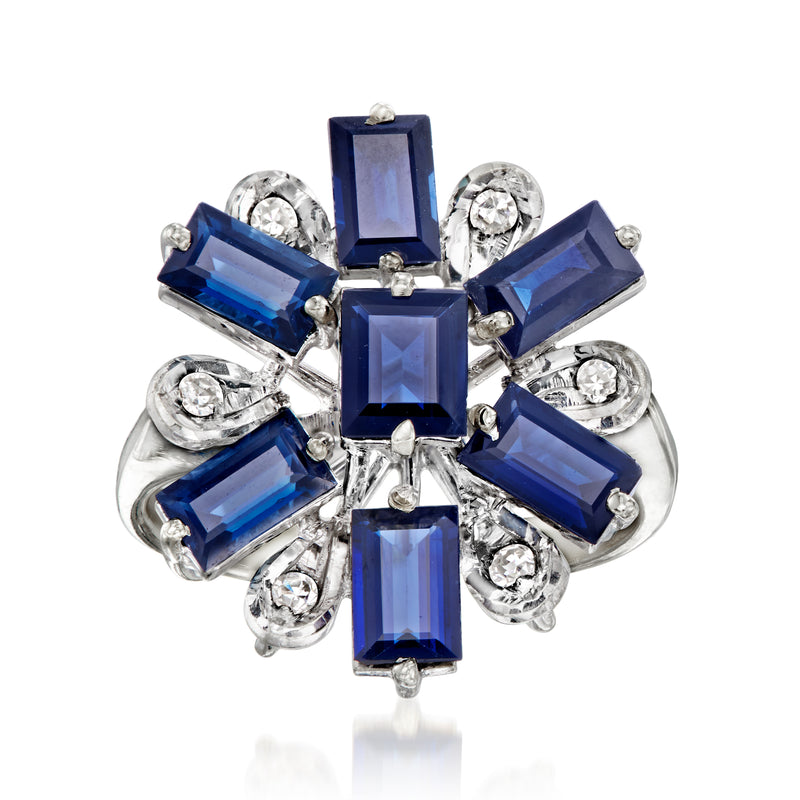 Vintage white gold cluster ring with blue sapphire baguettes and round diamond accents