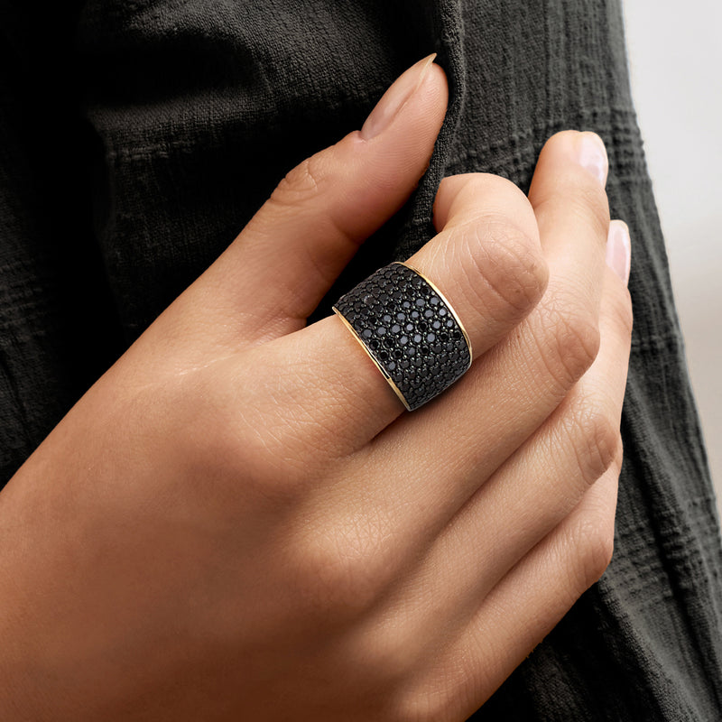 Wide pavé black spinel ring in 18kt gold over sterling on a hand