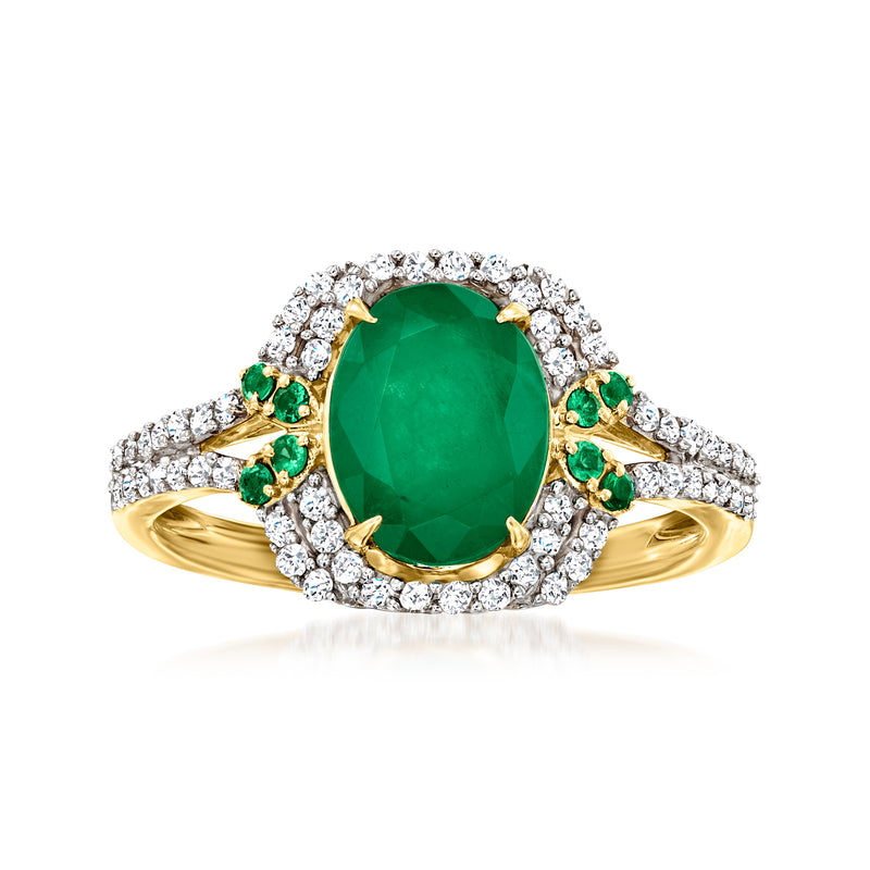 Oval green emerald centerpiece ring with diamond halo and small green accents, 14kt yellow gold
