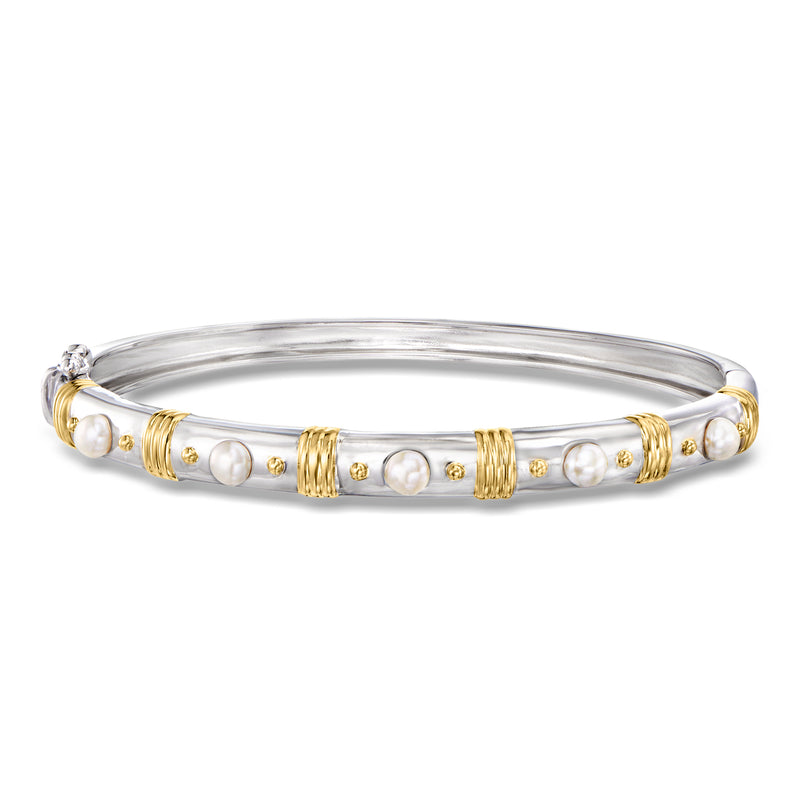 Two-tone sterling silver pearl bangle with small white cultured pearls and gold accents