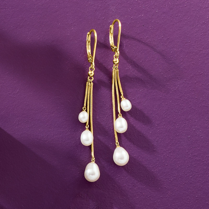 Gold leverback cultured pearl earrings with cascading white pearls on drop chains