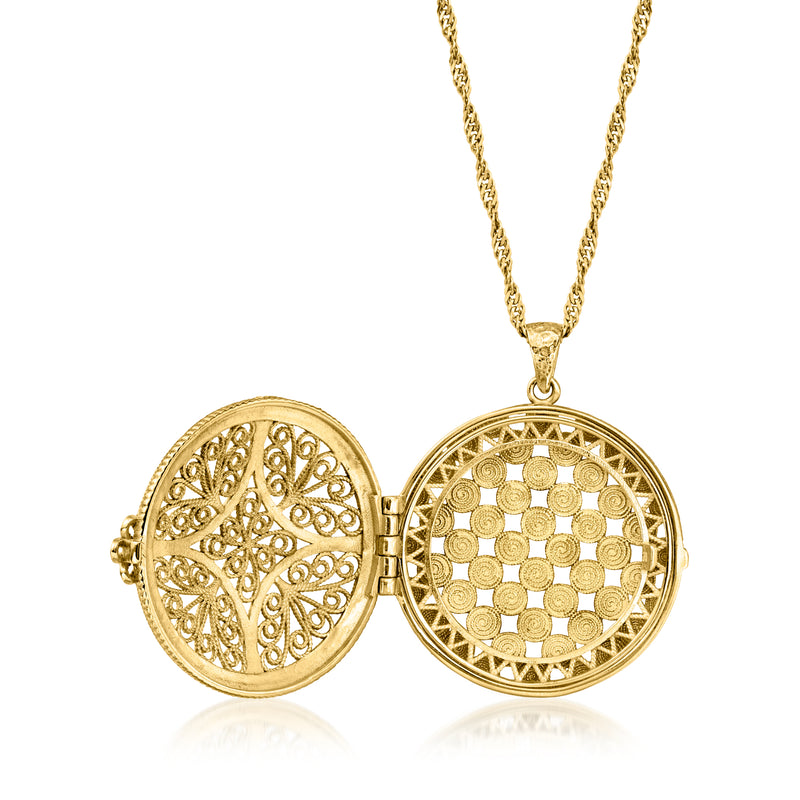 Gold-tone filigree locket with hinged open face and coin-textured back