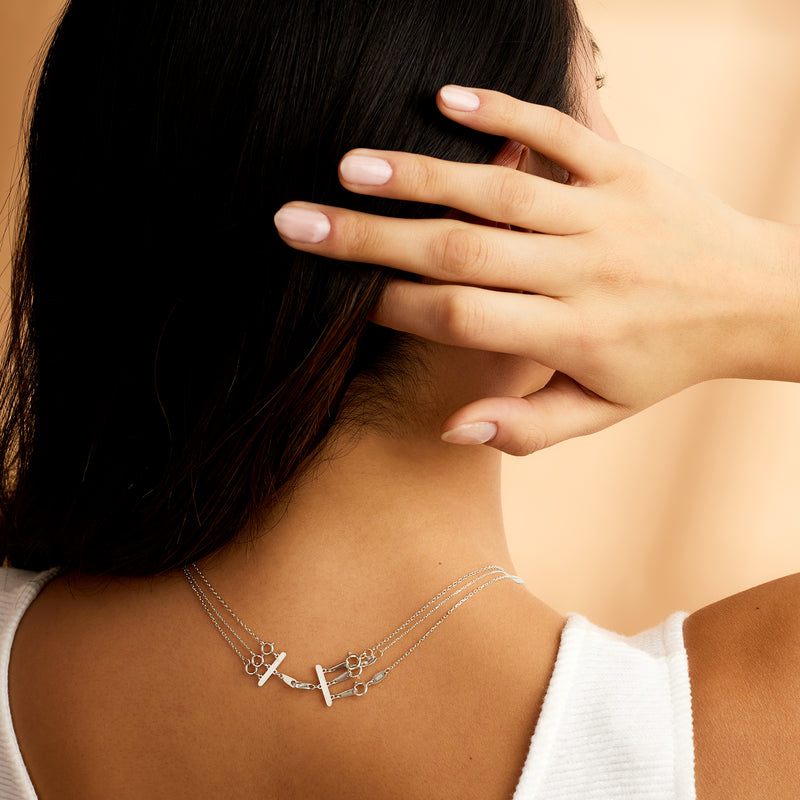 Sterling silver layering clasp on necklace chain, with ring and clasp links
