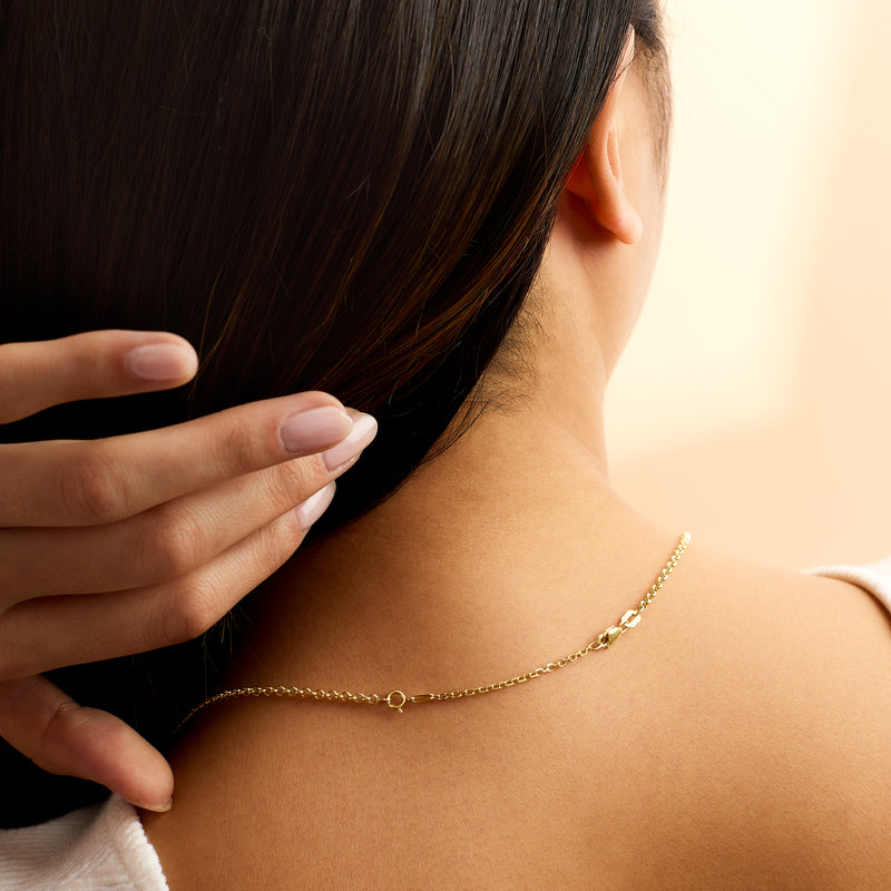 14kt yellow gold cable-chain necklace extender worn on neck