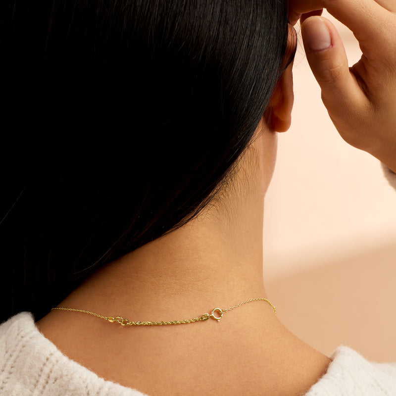14kt yellow gold rope-chain necklace extender worn as a thin link chain