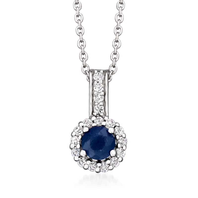 Sterling silver pendant with blue sapphire round center framed by white topaz