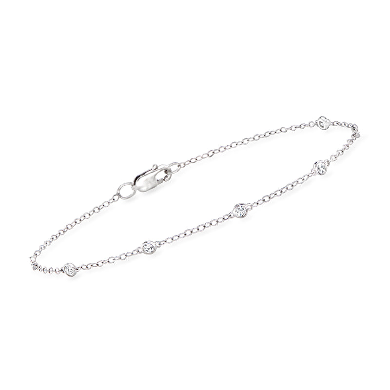 Sterling silver diamond station bracelet with bezel-set round stones and clasp