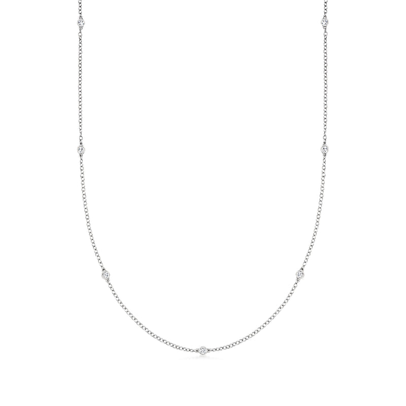 Sterling silver diamond station necklace with small round bezel-set stones