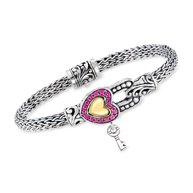 Sterling silver heart lock bracelet with pink gemstone and yellow gold heart detail