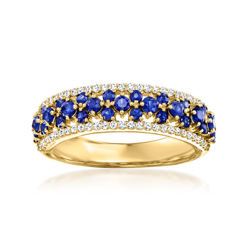 18kt yellow gold ring with blue sapphires and small round diamonds in a curved halo