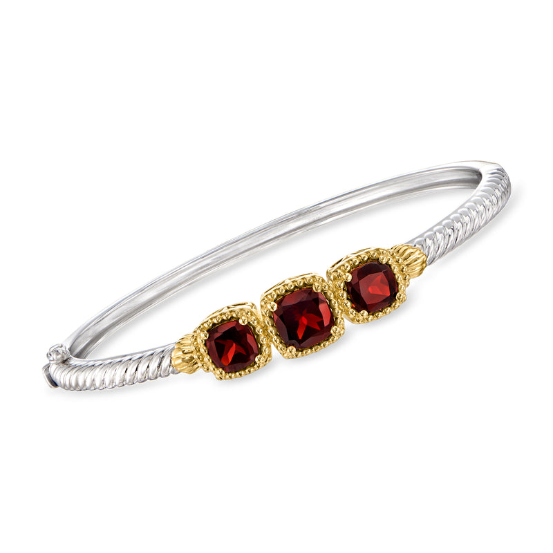 Two-tone sterling silver bangle bracelet with red garnet-style round stones