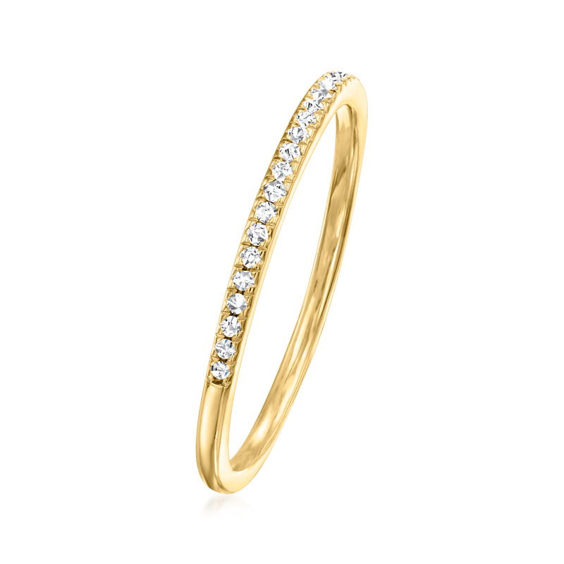 Gold-tone slim band ring with round stones on the raised row, side view