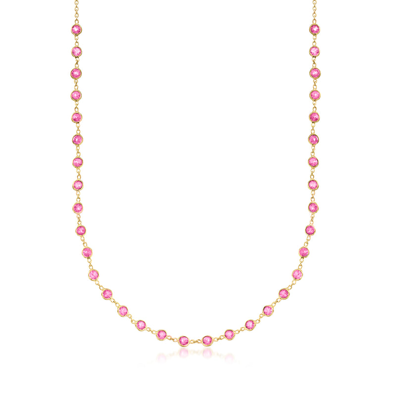 Pink gemstone tennis necklace with gold links and round topaz stations