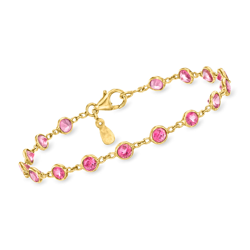 Pink topaz tennis bracelet with oval links and round gemstones in gold tone