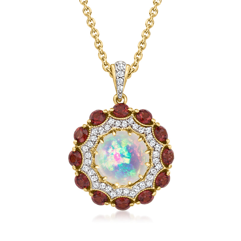 Multi-gemstone pendant necklace with opal-like center, red gemstone halo, gold chain.