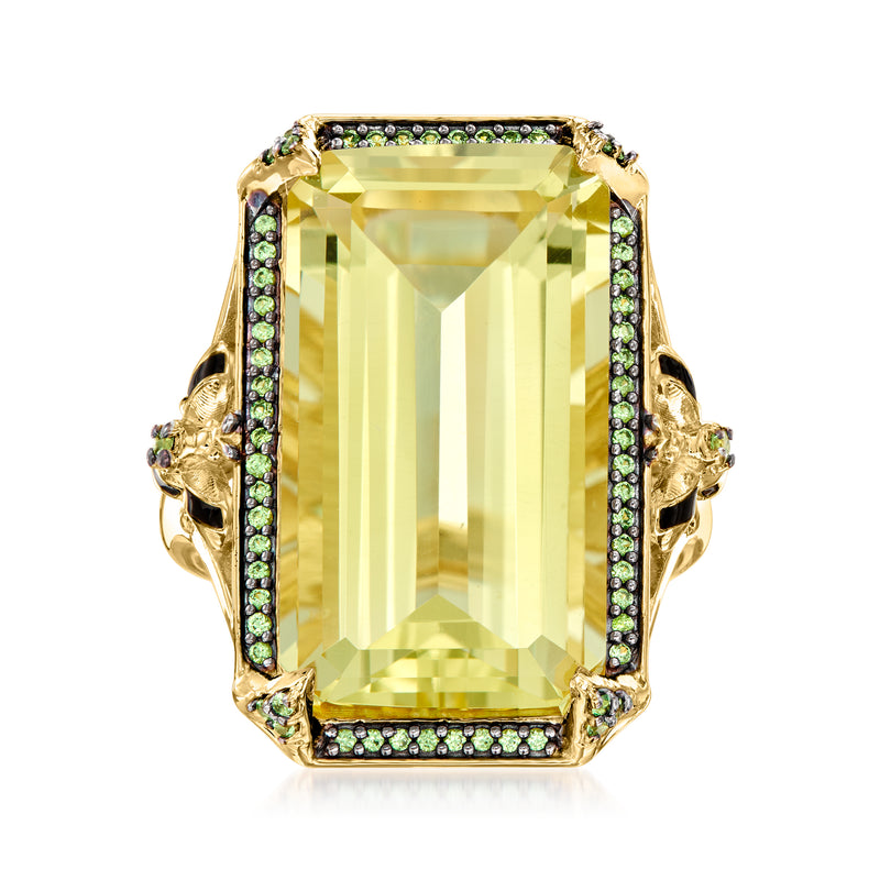 Gold ring with lemon-yellow rectangular gemstone, green accents, black enamel side details