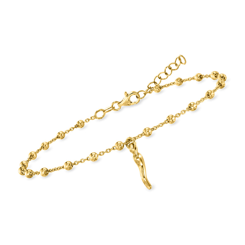 Gold beaded station anklet with small horn charm on linked chain